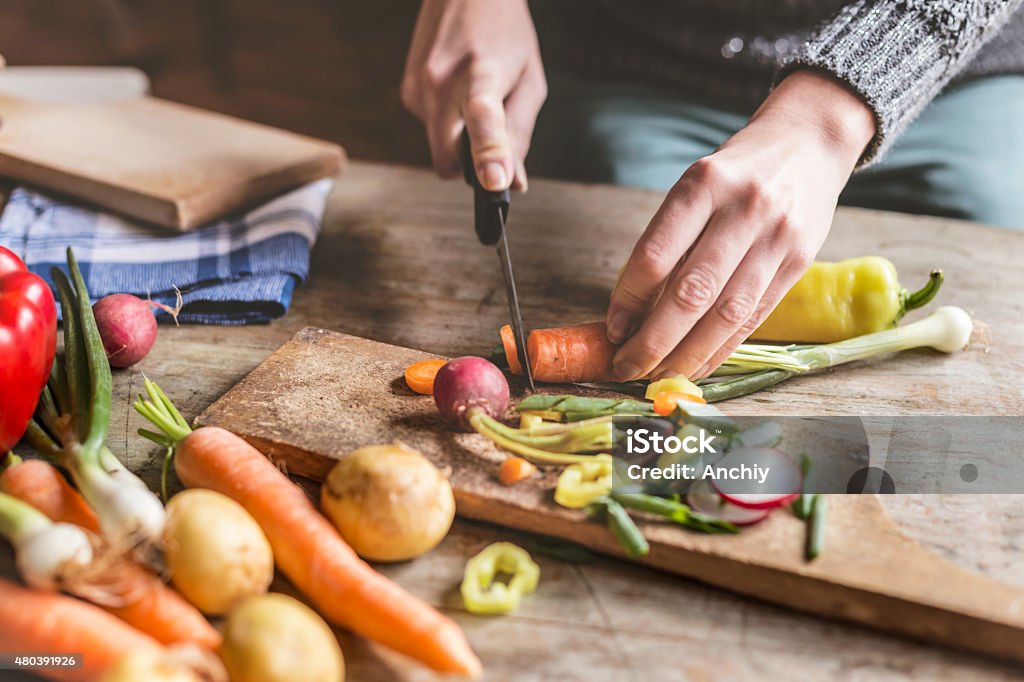 Chopping food ingredients Woman Chopping food ingredients Cooking Stock Photo