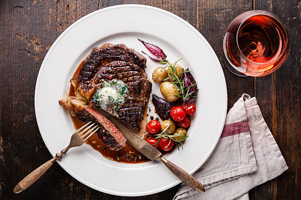 istock Steak Ribeye with herb butter and baby potatoes 480393720