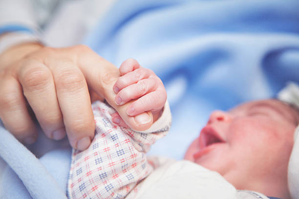 istock Newborn baby is holding 480393820