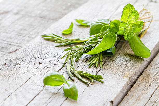 istock Selection of herbs and spices, rustic wood background 480396090