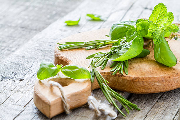istock Selection of herbs and spices, rustic wood background 480396114