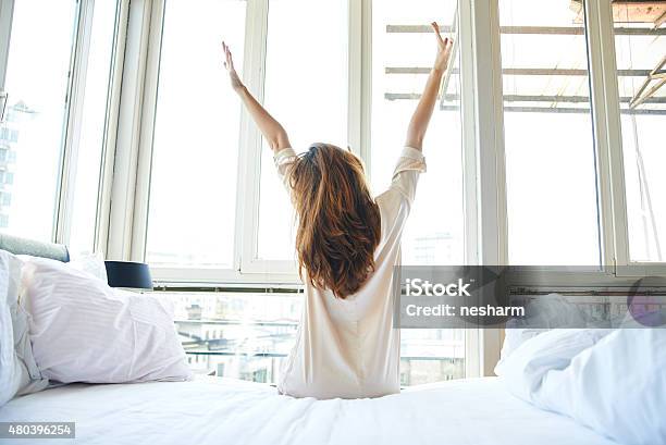 Morning Stretch In Bed Stock Photo - Download Image Now - Waking up, Women, Morning