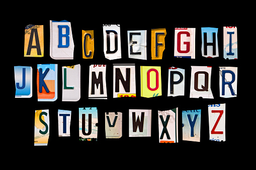 Alphabet set created with broken pieces of vintage car license plates