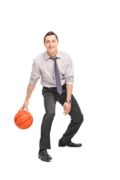 istock Cheerful young businessman playing basketball 480396502