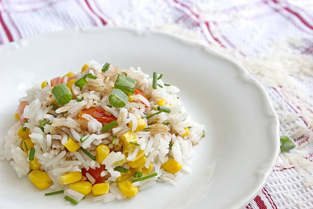 istock vegetable risotto - basmati rice with corns, tomatoes and onion 480396562