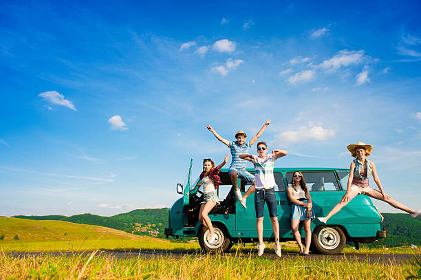 Young hipster friends on road trip Young hipster friends on road trip on a summers day hipster car stock pictures, royalty-free photos & images