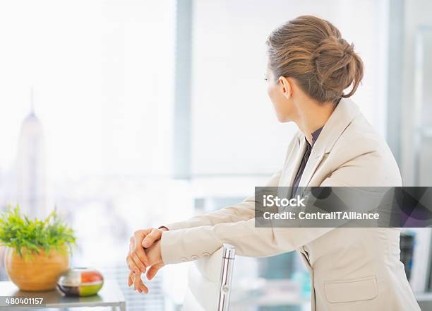 Business Woman Standing In Office Rear View Stock Photo - Download Image Now - Adult, Business, Business Person