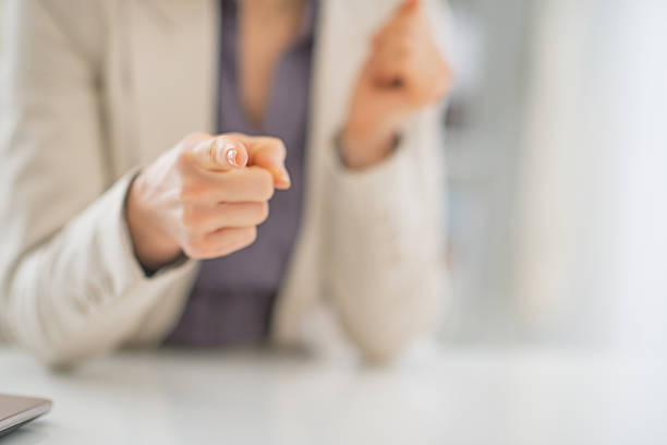 istock closeup on business woman pointing in camera 480401315