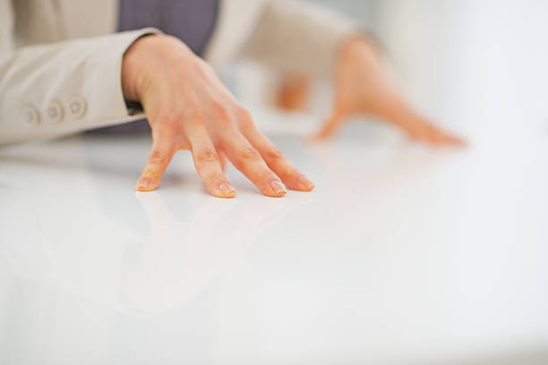 Closeup on business woman hands on desk