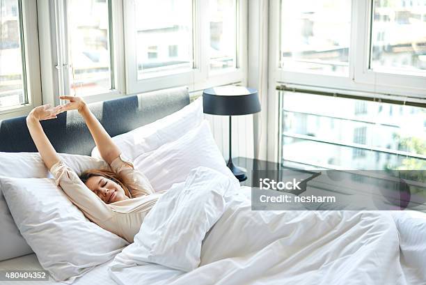 Morning Stretch In Bed Stock Photo - Download Image Now - Waking up, Bed - Furniture, Women