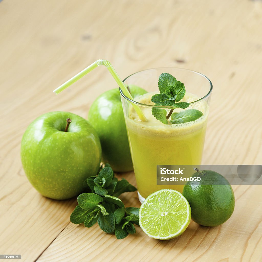 Fresh juice A glass of fresh apple, lime and mint juice, shallow depth of field Drink Stock Photo