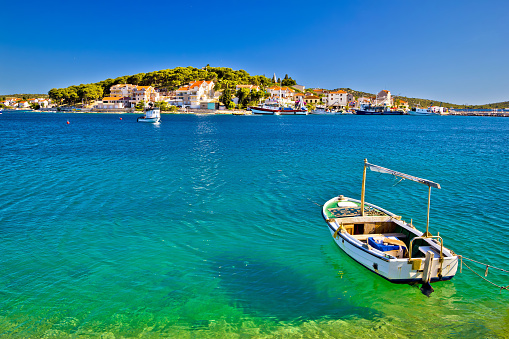 Turquoise beach and boat in Rogoznica, Dalmatia, Croatia