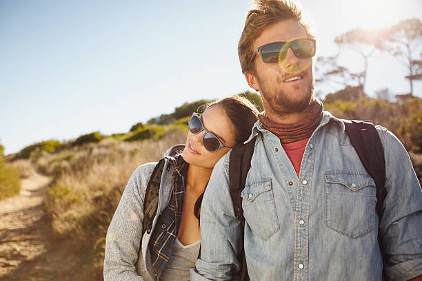 istock Young hiking couple enjoying nature 480415144