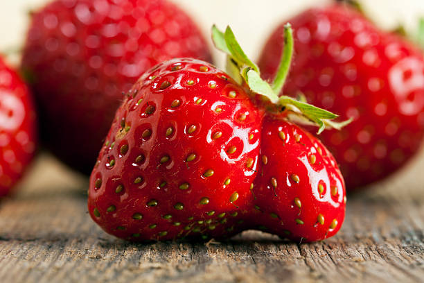 Twin Strawberry Strangely shaped double strawberry closeup misshaped stock pictures, royalty-free photos & images