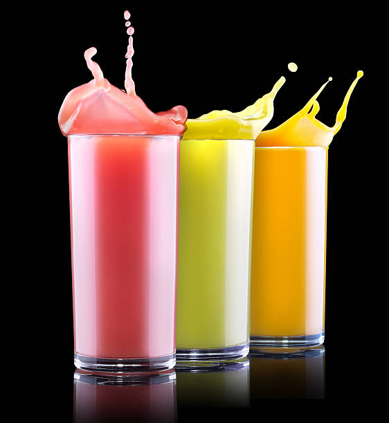 tasty summer fruit drinks in glass with splash