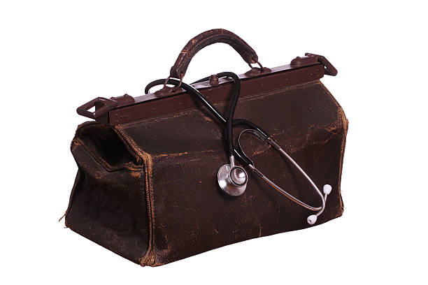 old bag with stethoscope old bag with stethoscope briefcase photos stock pictures, royalty-free photos & images