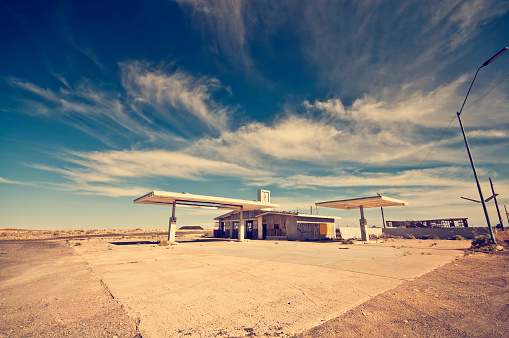 Wide angle shot of a deserted gas station. Many ghost places like that you will find along the historic route 66.