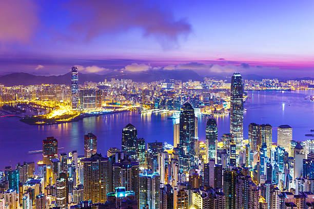 Hong Kong skyline at dawn Hong Kong skyline at dawn victoria harbour stock pictures, royalty-free photos & images