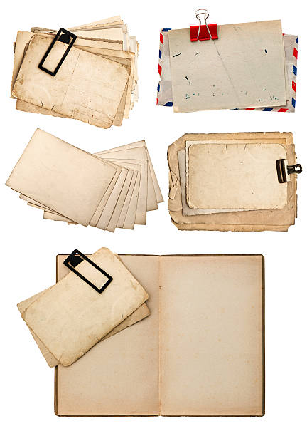 istock old book, vintage postcards and paper on white 480425409