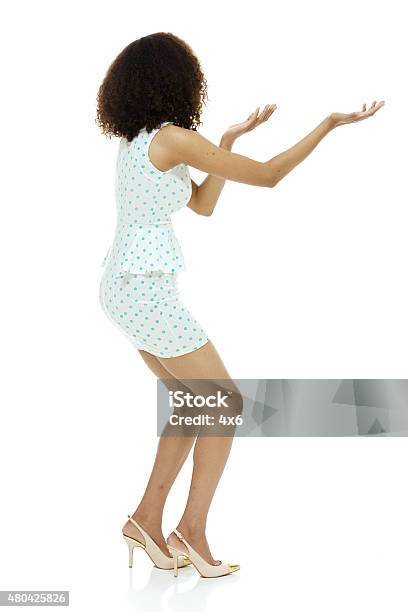Rear View Of Woman Presenting Stock Photo - Download Image Now - 20-29 Years, 2015, 25-29 Years