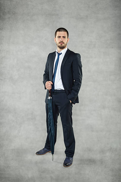 istock businessman with umbrella 480431253