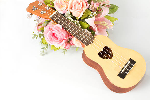 istock Ukulele and beautiful flower on white background 480437658