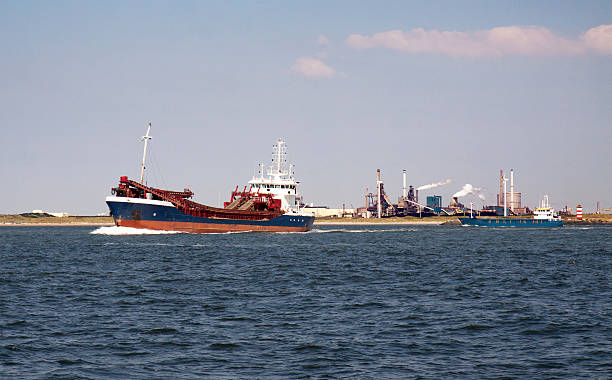 istock Freighter near coastal industrial facilities 480440660