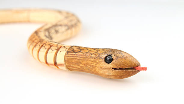 istock Wooden toy snake - head in focus 480440793