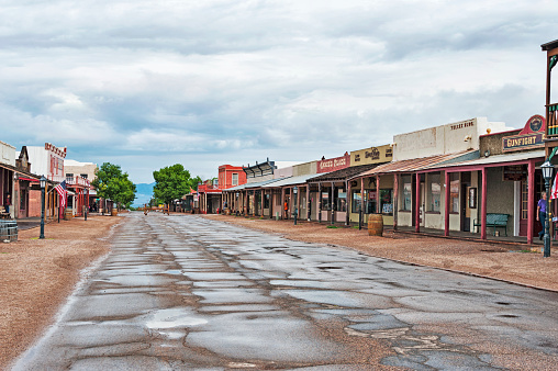 Tombstone, Arizona, USA - July 5, 2015: This Street scene is a great location to visit while in Tombstone Arizona with the colorful store fronts and the signs and placards it helps to create the views of historic Tombstone Arizona and on this July Day it was a fun visit.