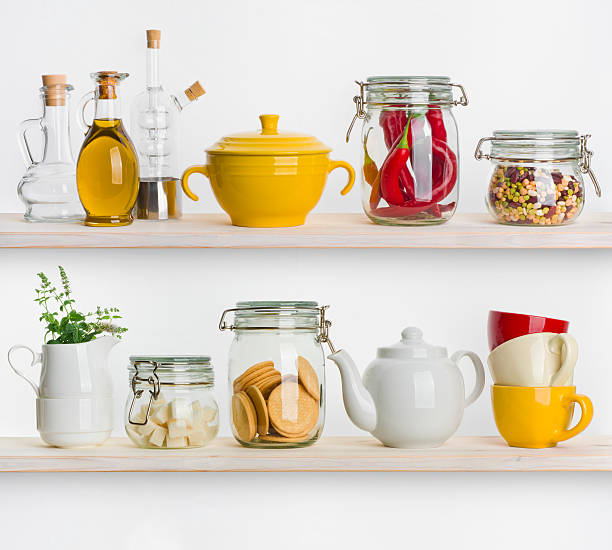 istock Kitchen shelves with various food ingredients and utensils on white 480446872