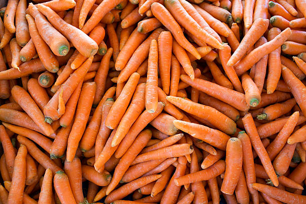 istock Fresh young carrots on farm market 480447138