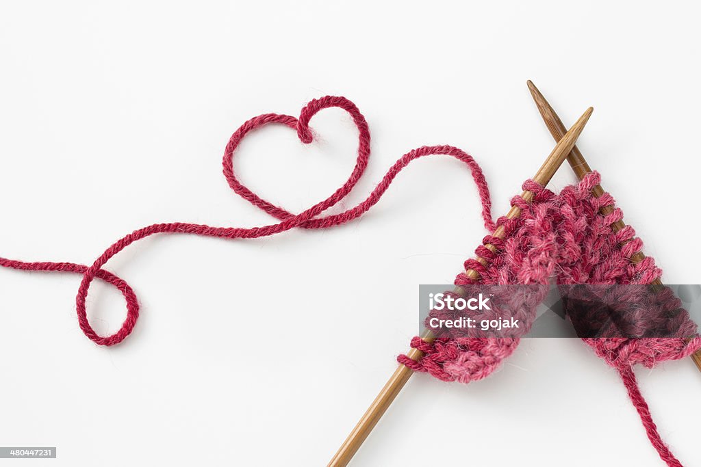 Knitting Incomplete knitting project with wooden needles Knitting Stock Photo
