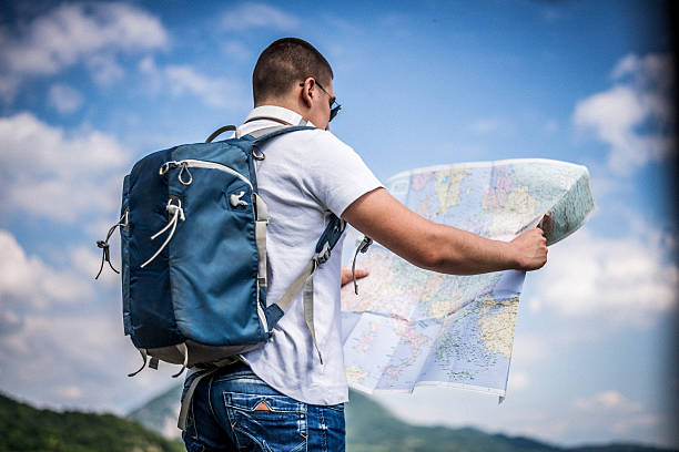 istock Tourist with a map on the mountain 480447420