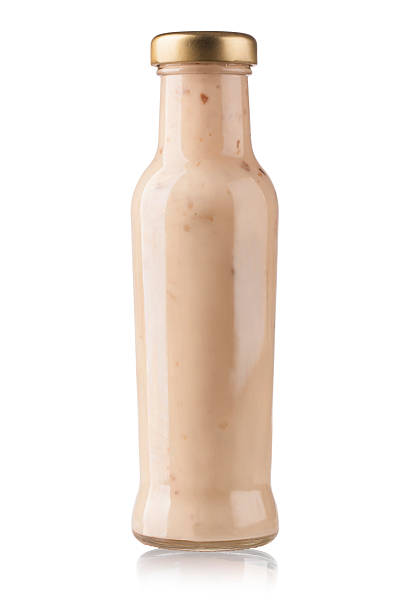 istock Glass bottle of white sauce 480447585