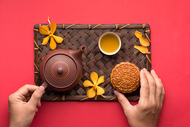 Mooncake and tea Mooncake and tea,food and drink for Chinese mid autumn festival. angle view from above chinese ethnicity china restaurant eating stock pictures, royalty-free photos & images