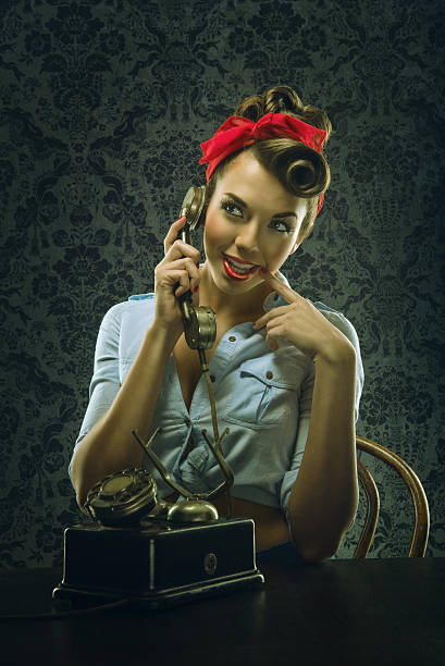 istock Vintage - Woman talking on the phone with dial phone 480452018