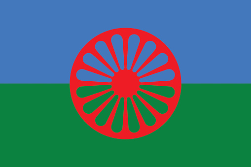 The flag consists of a background of blue and green, representing the heavens and earth, respectively. A 16-spoke red chakra, or spoked wheel, placed in the centre, representing the itinerant tradition of the Romani people.