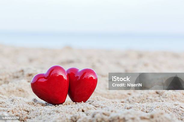 Two Red Hearts Symbolizing Love Valentines Day Romantic Couple Stock Photo - Download Image Now
