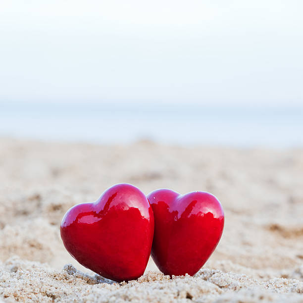 istock Two red hearts symbolizing love, Valentine's Day, romantic couple 480454521