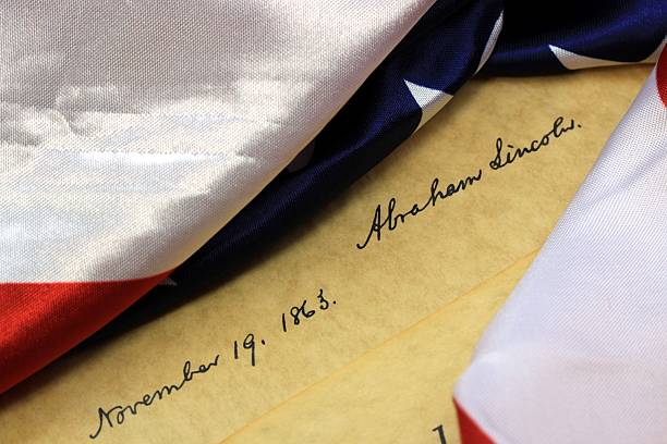 istock American Constitution and US Flag 480455255
