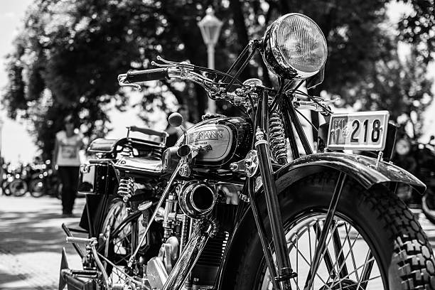 Russian vintage rusty motorcircle at the field in sunny day. Soviet military retro motorcycle