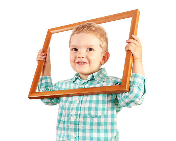 istock Kid hold wooden picture frame on white background 480456058