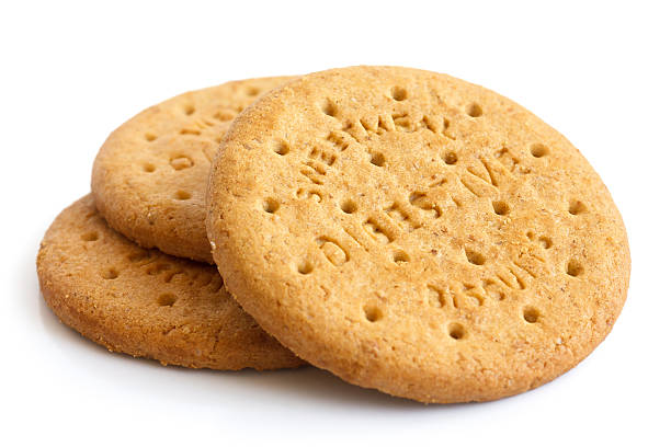 Stack of sweetmeal digestive biscuits isolated on white. Stack of sweetmeal digestive biscuits isolated on white. Digestive Biscuit stock pictures, royalty-free photos & images