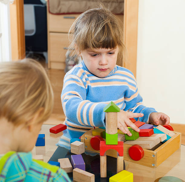 istock adorable siblings together with toys 480456675