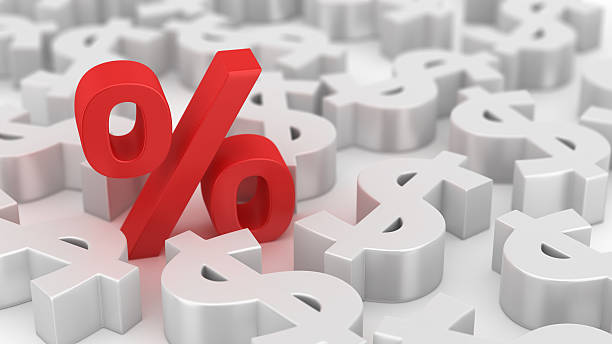 Mighty percent of dollars Single red percent symbol among many dollars currency symbol photos stock pictures, royalty-free photos & images