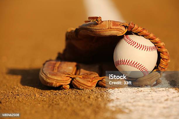 Baseball In A Glove On The Infield Stock Photo - Download Image Now - Youth Baseball, High School Baseball, Sports Glove
