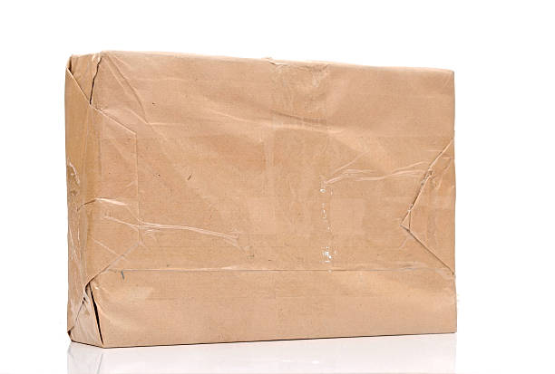 istock parcel wrapped with brown paper isolated on white background 480463729