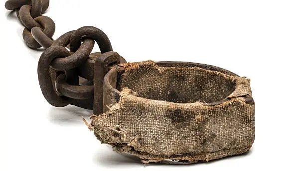 Rusty padded shackles used for locking up prisoners or slaves between 1600 and 1800.  This might be a leg cuff or a neck cuffRusty padded shackles used for locking up prisoners or slaves between 1600 and 1800.Rusty padded shackles used for locking up prisoners or slaves between 1600 and 1800.  This might be a leg cuff or a neck cuff