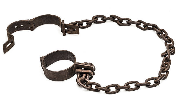 Old chains or shackles used for prisoners or slaves stock photo