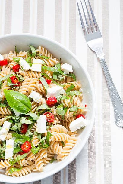 istock Wholewheat pasta wth chopped basil, feta cheese and red chilli 480465168